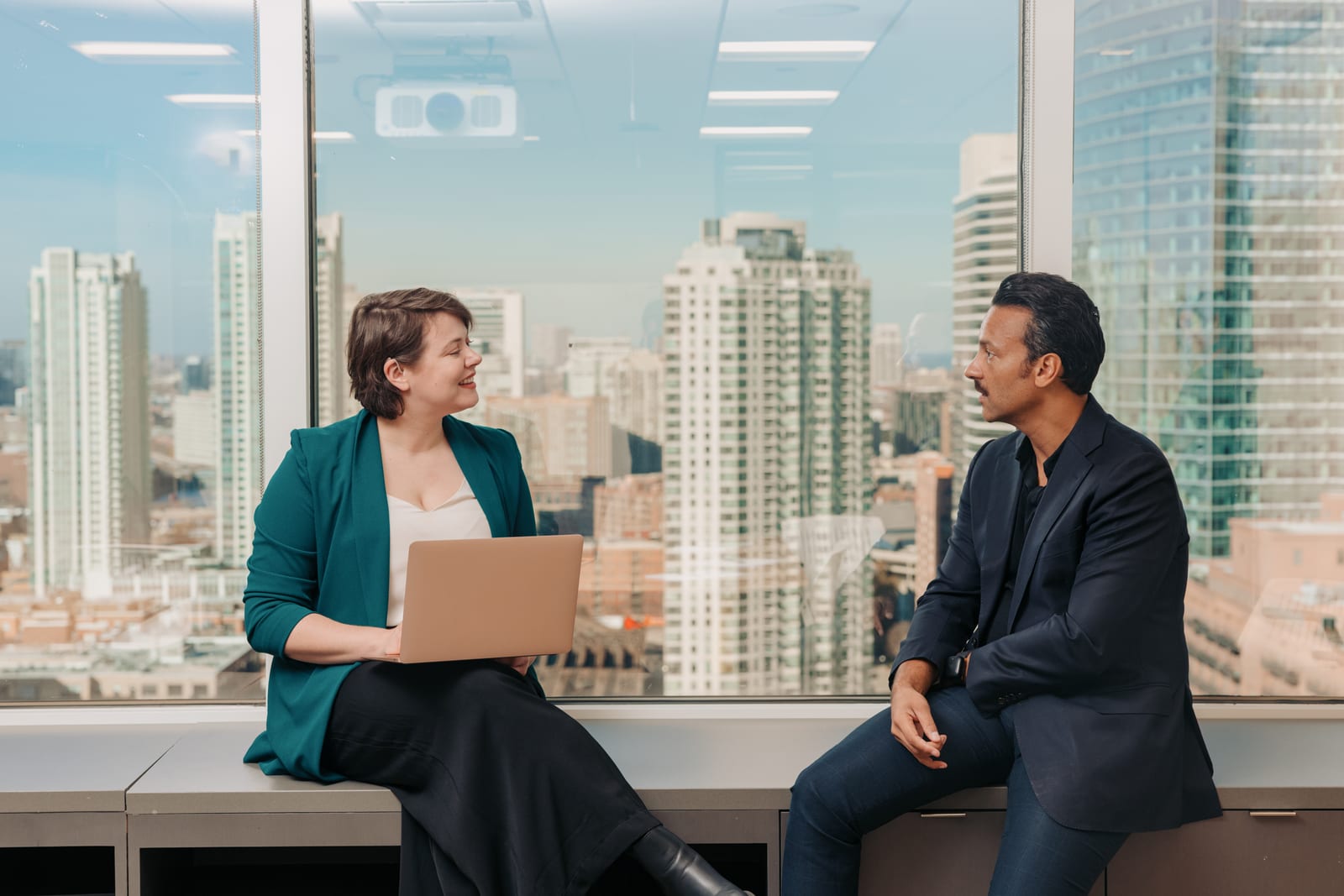Two colleagues collaborating in an accessible workspace